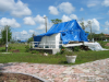 Image de couverture de Blue Tarp on City of Punta Gorda History Park Cigar Cottage After Hurricane Charley